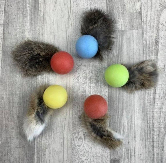 Rattle ball with rabbit fur tail
