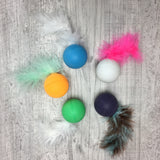 Rattle ball with feather tail